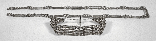 A silvery metal six bar gate link 15c282