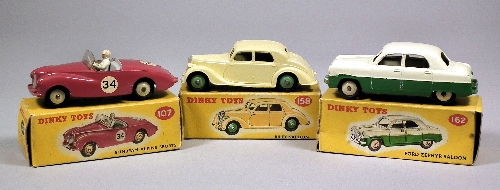 Three early Dinky diecast cars