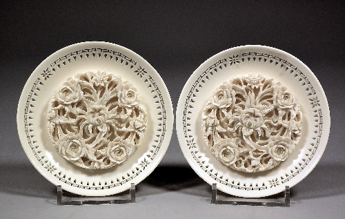 A pair of Chinese ivory circular dishes