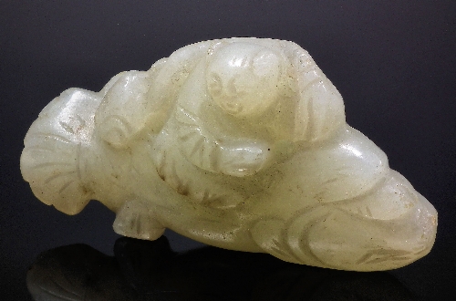A Chinese pale green jade carving