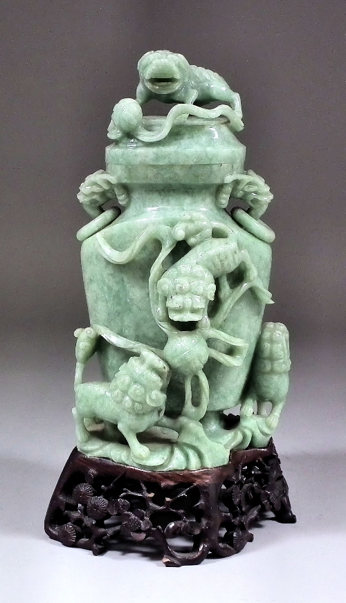 A Chinese mid green jadeite two-handled