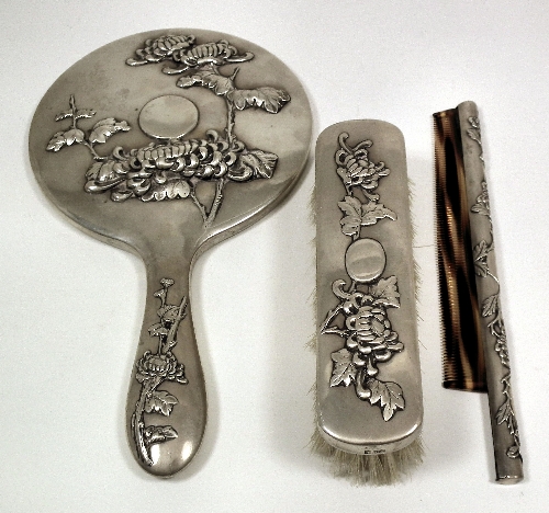 A Chinese silvery metal three piece