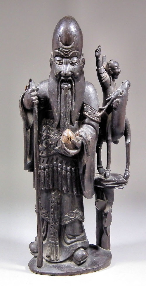 A Chinese root carving of a standing 15c3e1