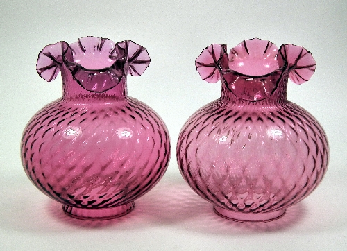 A pair of Victorian cranberry glass