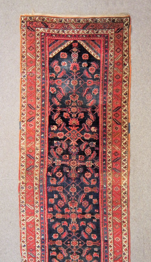 An antique Hamadan runner woven