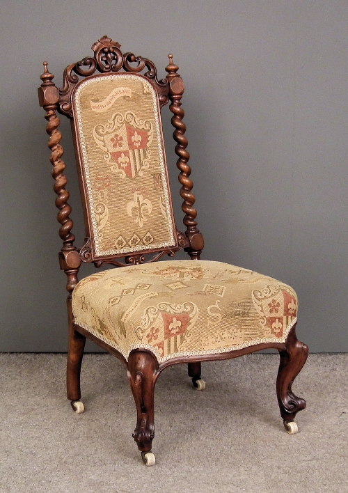 A Victorian walnut nursing chair