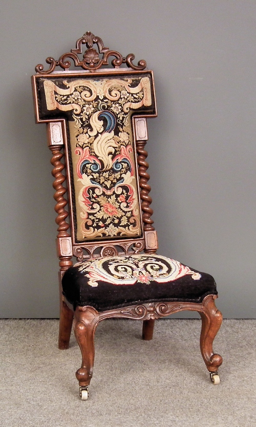 A Victorian walnut nursing chair