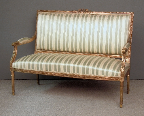 A gilt framed two seat settee of