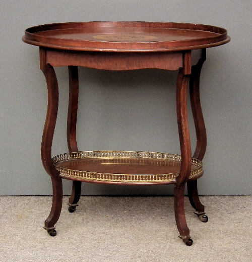 An Edwardian oval two tier occasional