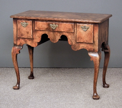 A walnut lowboy/dressing table