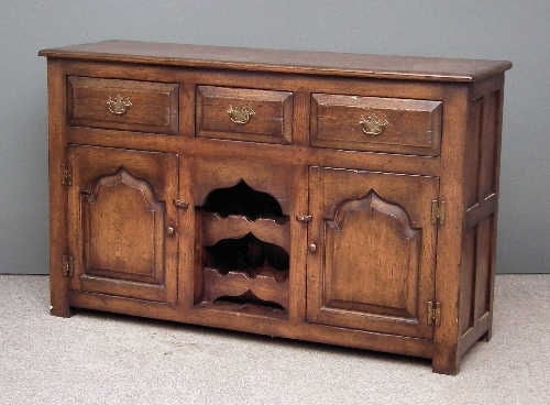 A panelled oak dresser base of