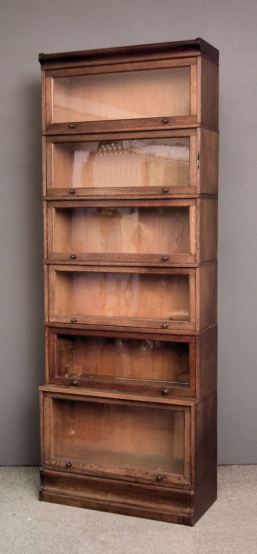 An oak six tier sectional bookcase of