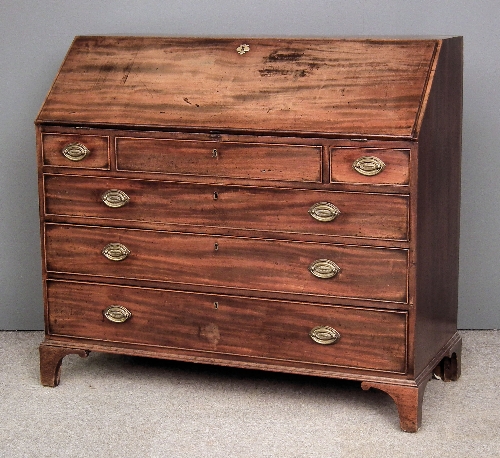 A George III figured mahogany bureau 15c4ad