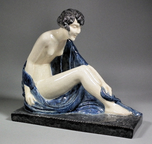 A French Etling seated pottery figure