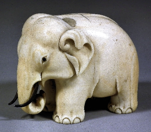 A Chinese carved ivory elephant
