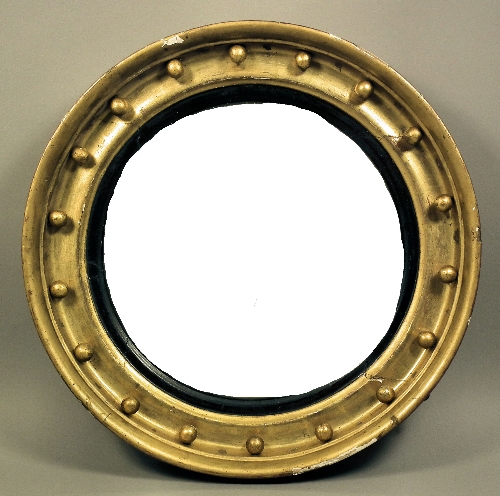A late Georgian gilt framed circular