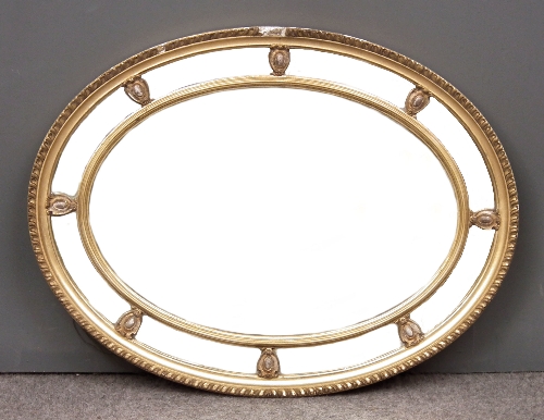 A gilt framed oval wall mirror 15ceea