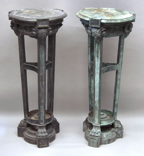 A pair of green patinated bronze