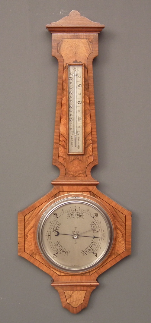 A 1930s walnut cased aneroid barometer