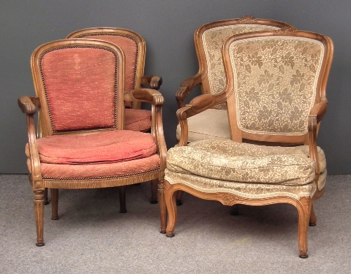 A pair of French beechwood framed fauteuils