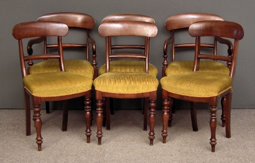 A set of six stained wood dining chairs