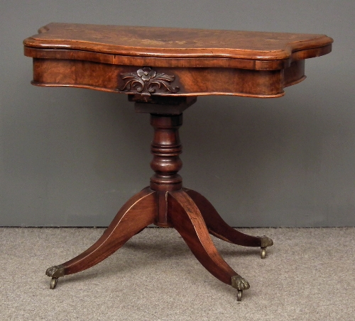 A Victorian walnut card table the