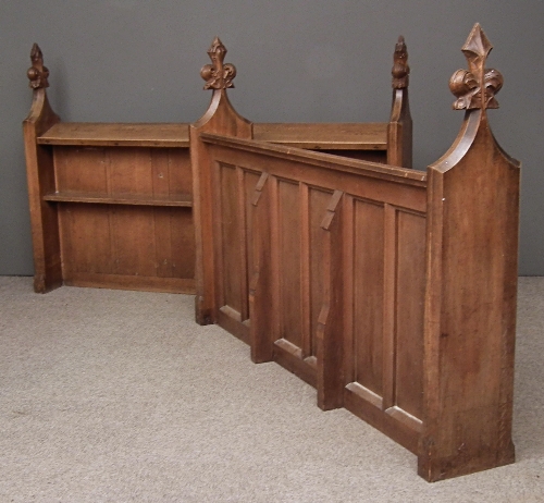 A pair of Victorian oak choir stalls