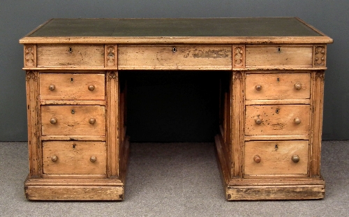 A Victorian stripped pine desk of Gothic