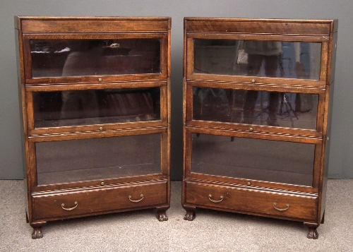 Two 1920s stained wood three tier sectional