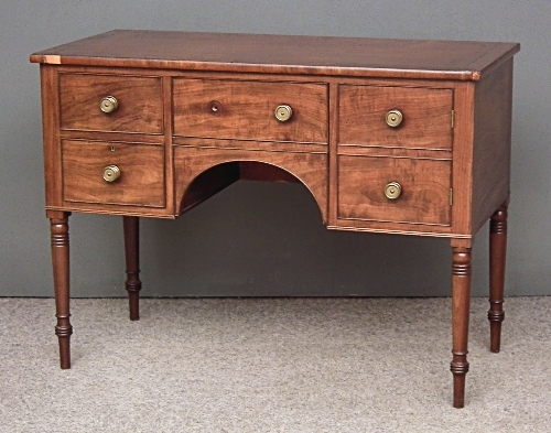 A George IV figured mahogany sideboard