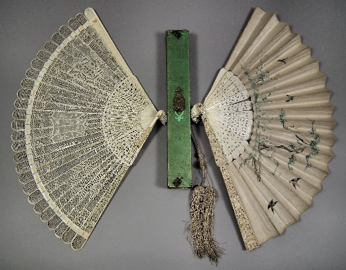 A Cantonese carved ivory fan with silk