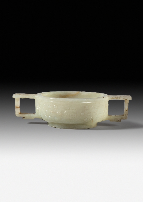 A Chinese celadon green jade two-handled