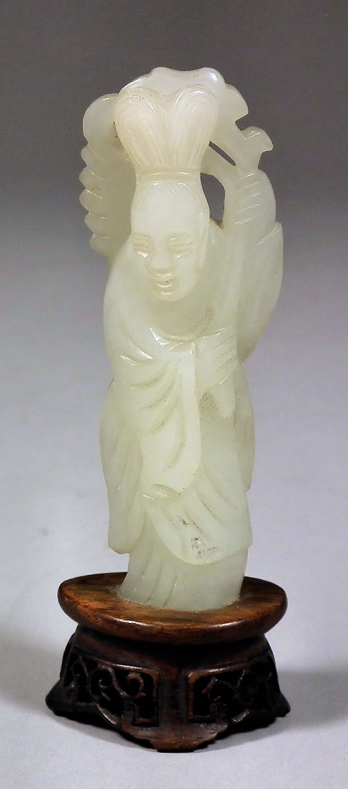 A small Chinese celadon jade figure
