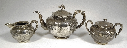 A Chinese silvery metal three piece