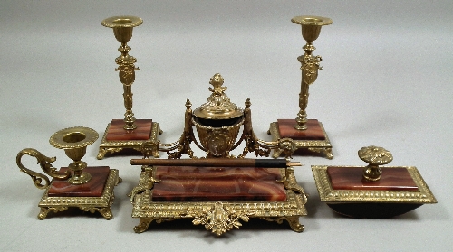 A red onyx and gilt metal desk set of
