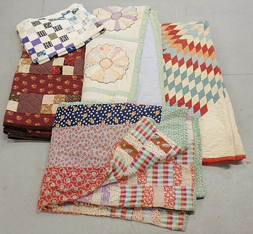 Box of patchwork quilts etc. As found.