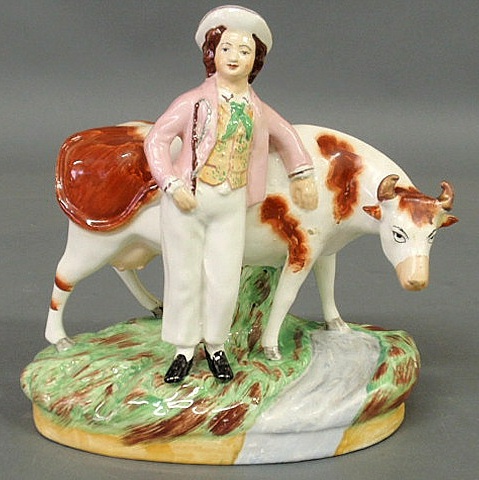 Staffordshire figure of a boy with a