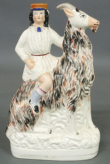 Staffordshire figure of a boy riding