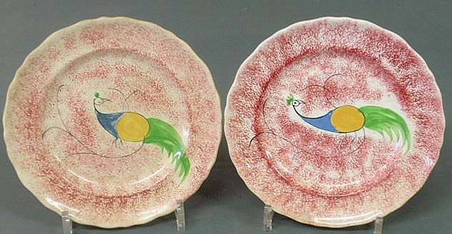 Two peafowl red spatterware plates