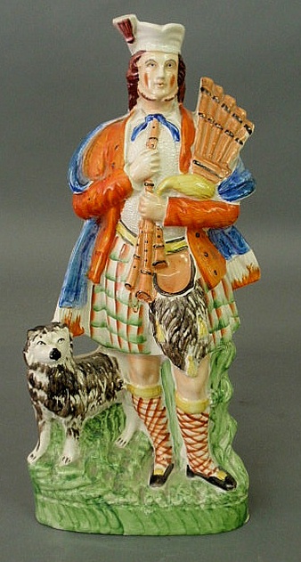 Colorful 19th c. Scottish bagpiper with
