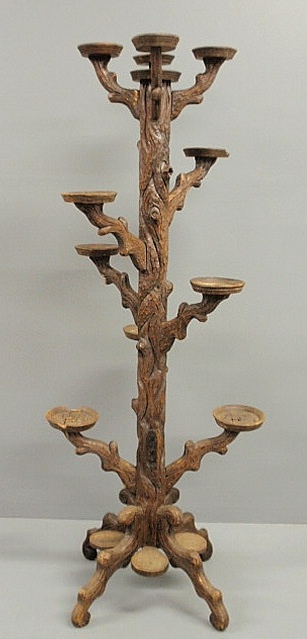 Black Forest carved plant stand in the