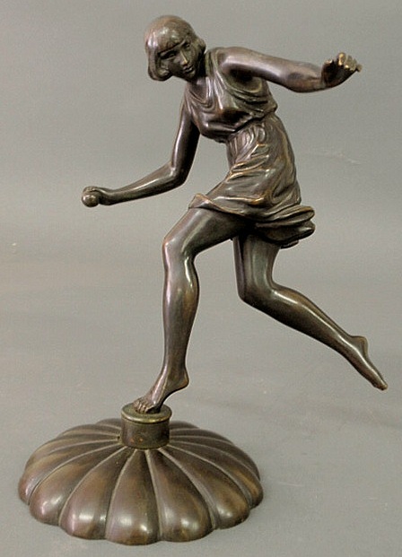 Bronze statue of a girl throwing