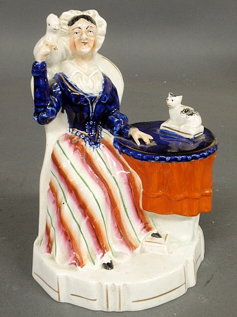 Staffordshire figure of a seated woman