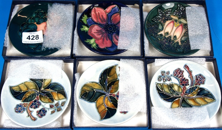 A collection of Moorcroft Coasters