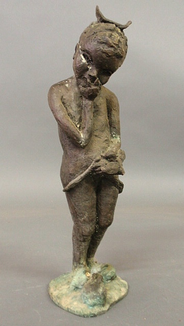 Bronze statue of a child and rabbits