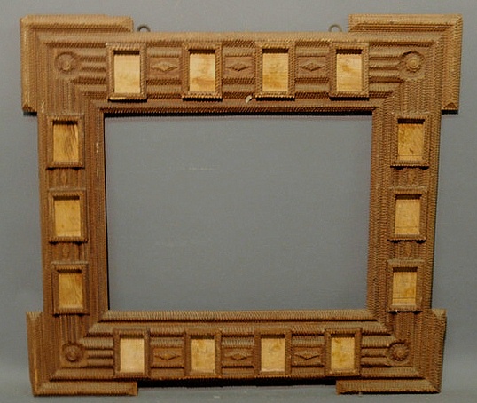 Large ornately carved Tramp Art frame.