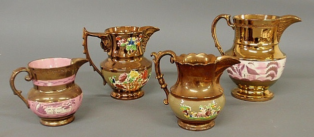 Group of four copper luster pitchers 15b226