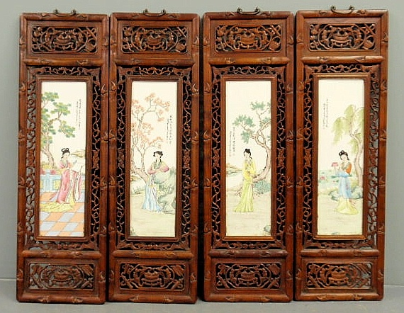 Four Asian carved exotic wood panels