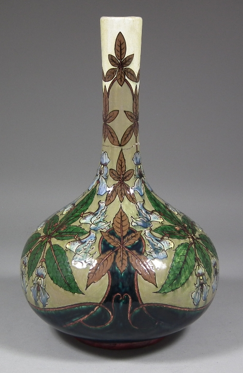 A Belgian pottery bottle shaped vase