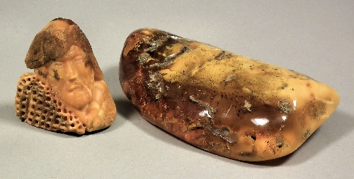 A small carved amber bust of a 15b963